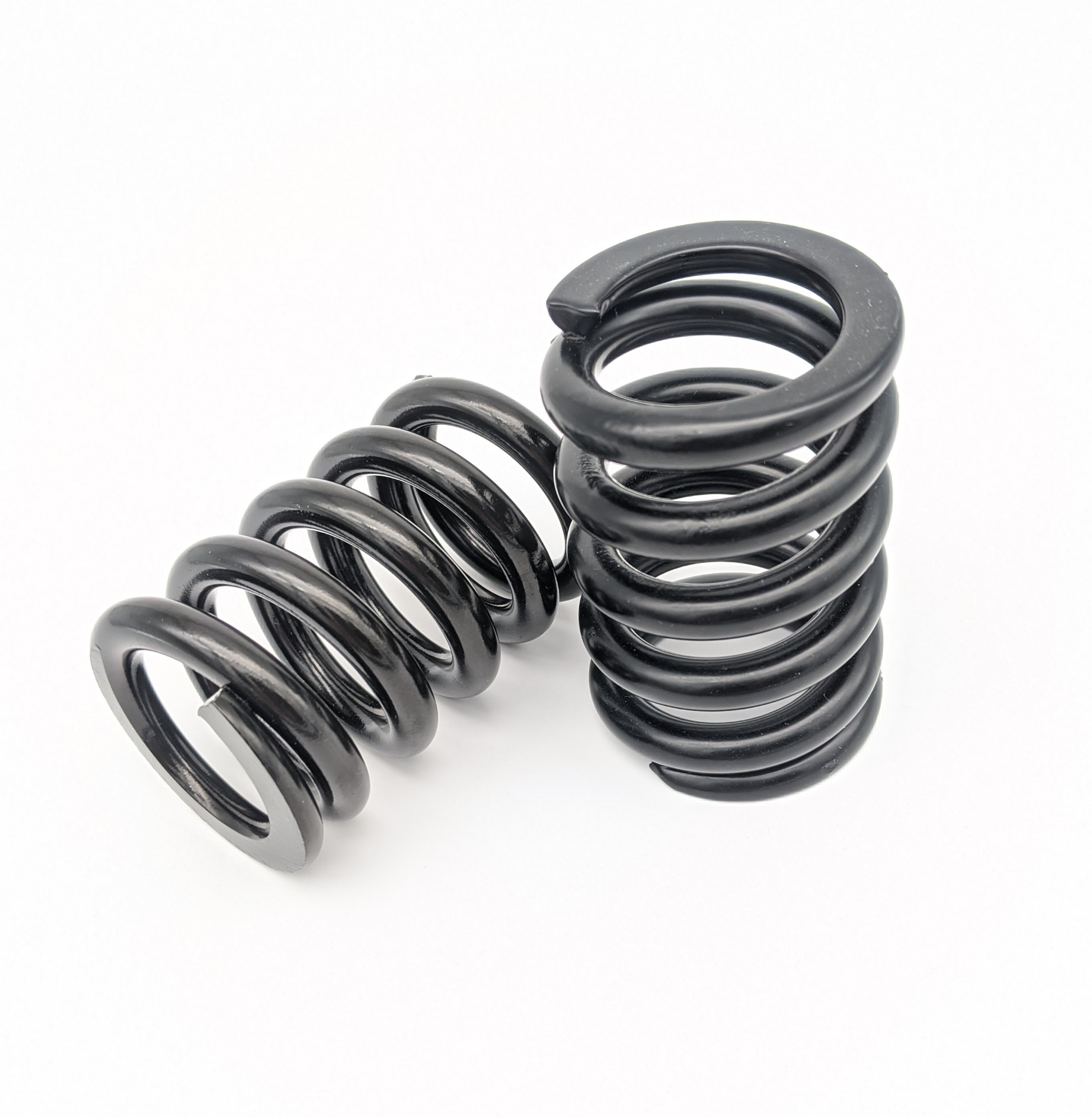 Two custom coil springs with e-coat finishing in black