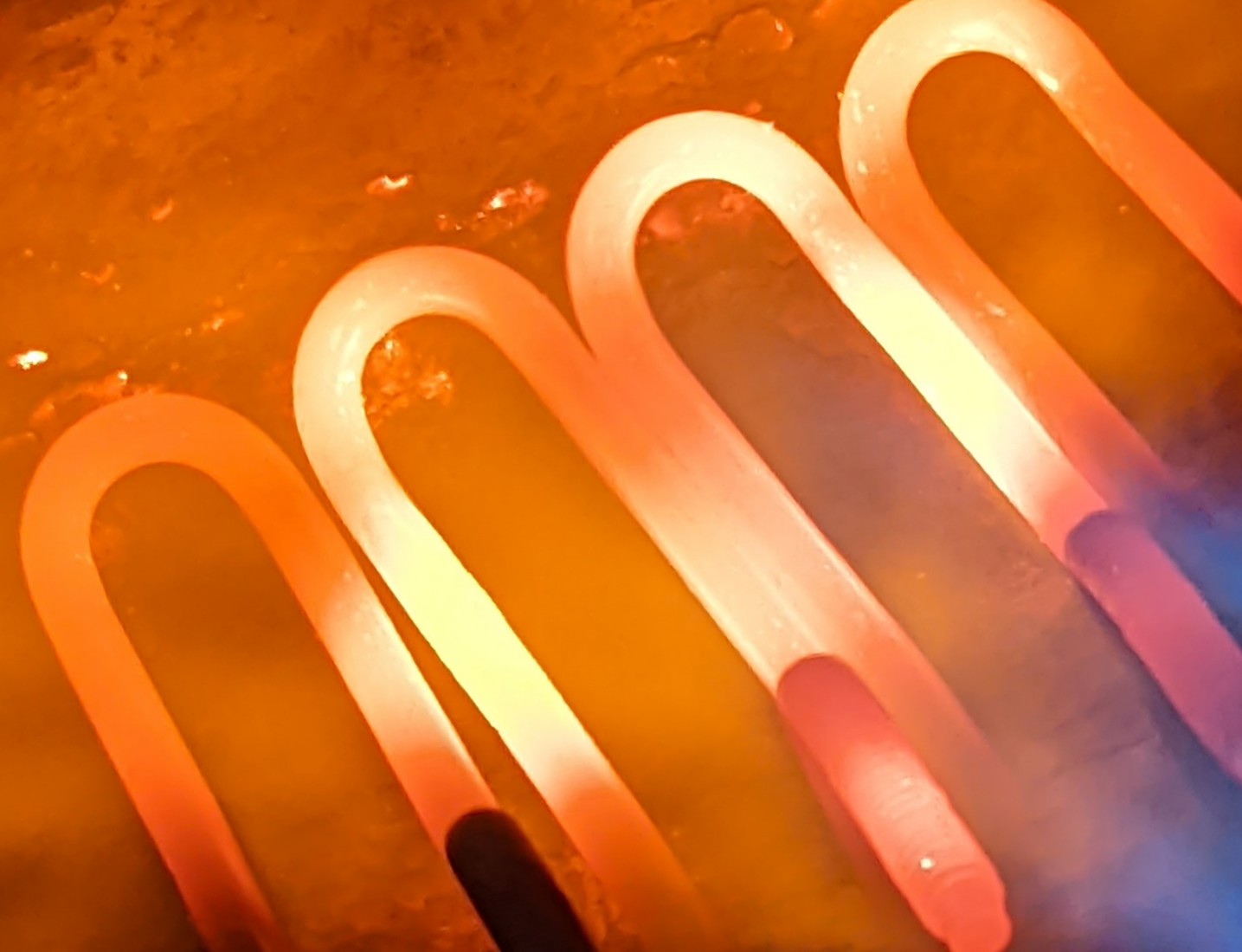 Heat treatment finishing for coil springs and wire forms