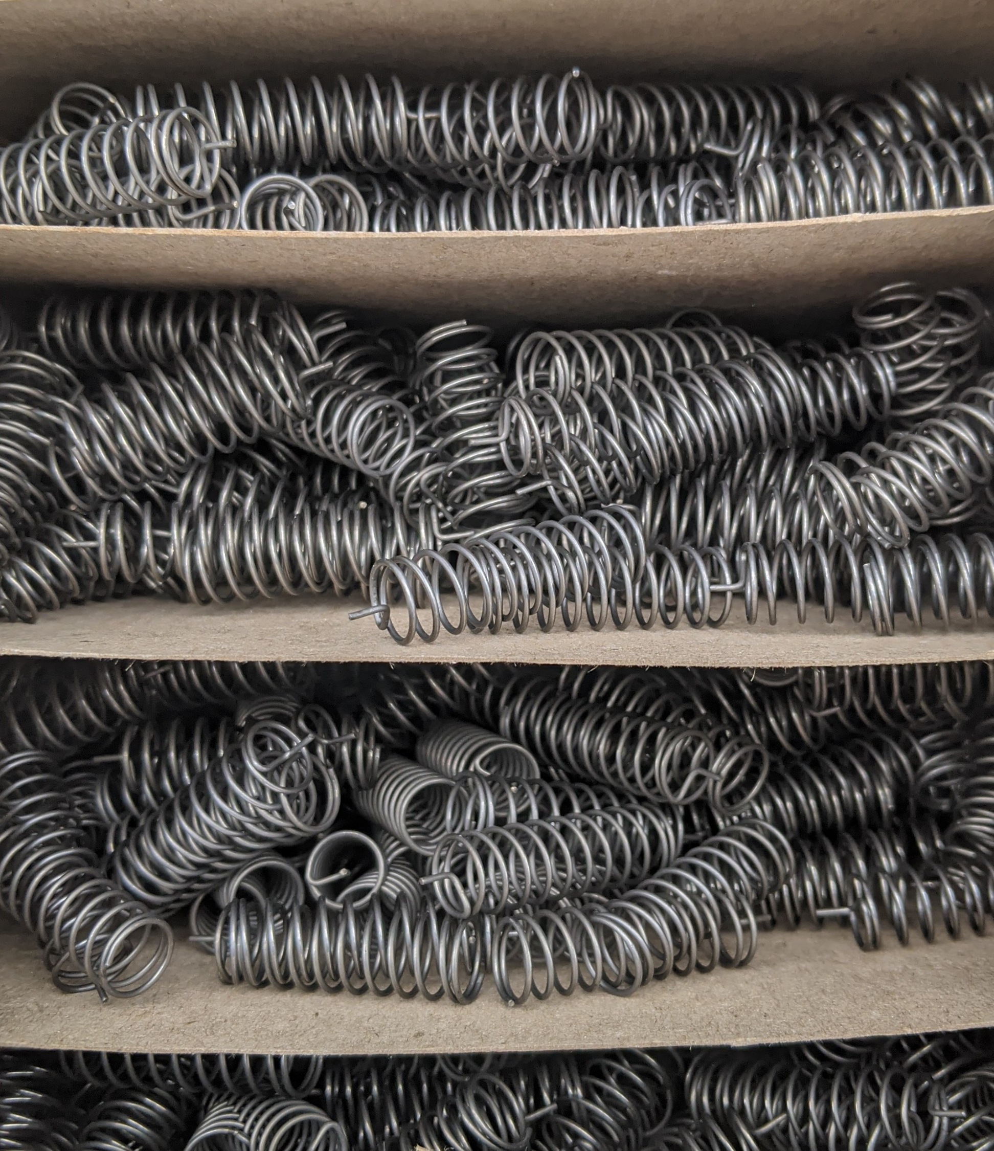 Multiple springs layer-packed to minimize tangling