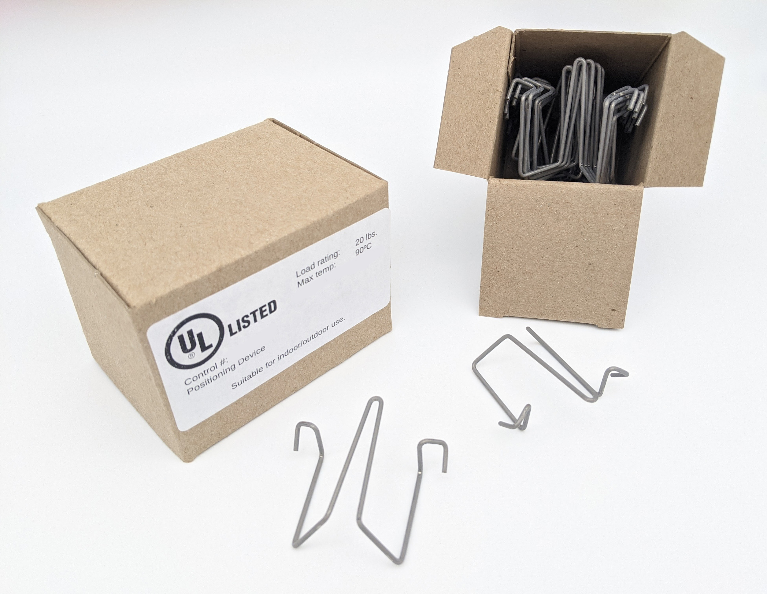 Wire clips nested in two labelled cardboard boxes