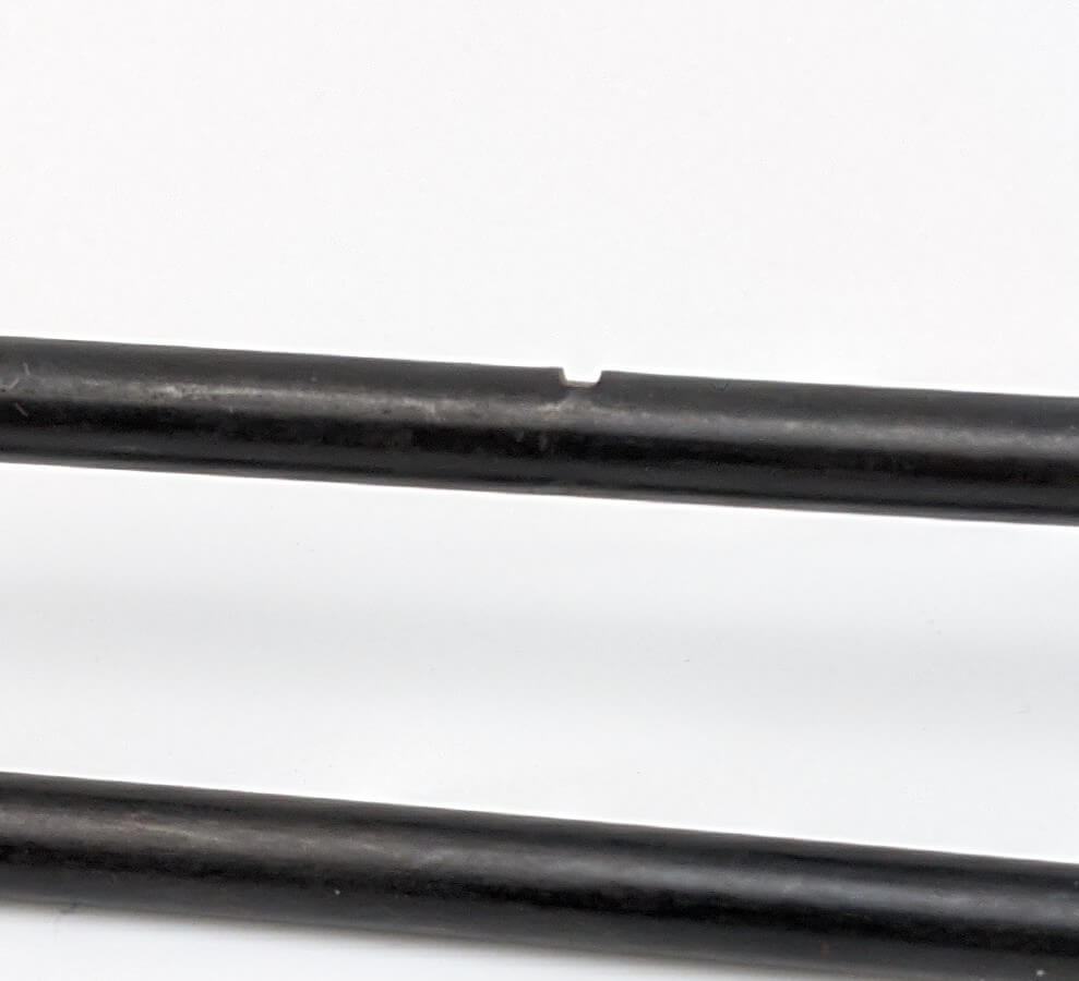 A black wire form with a notch